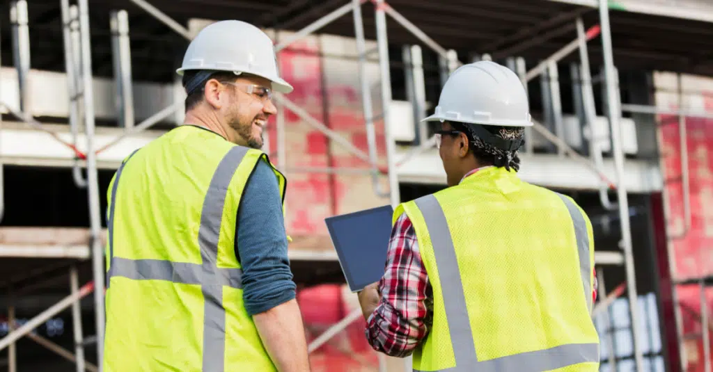 8 Must-Know Construction Technology Trends to Prepare For 1 Image of two construction crew workers for a blog about 8 technology trends.