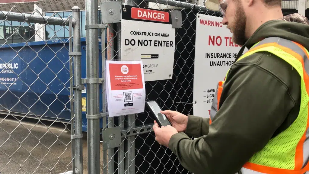 700+ Job Sites Adopt Mobile Health Screening Tool Built by SPARK 1 Construction worker enters a job site with a mobile health screening app built by SPARK.